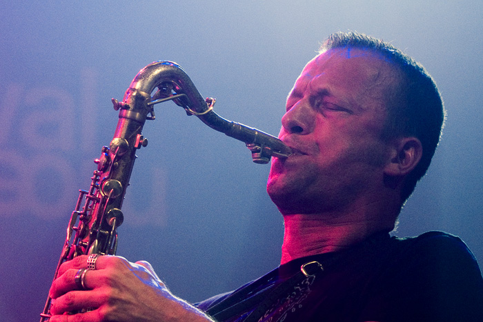 Mats Gustafsson playing tenor saxophone on stage